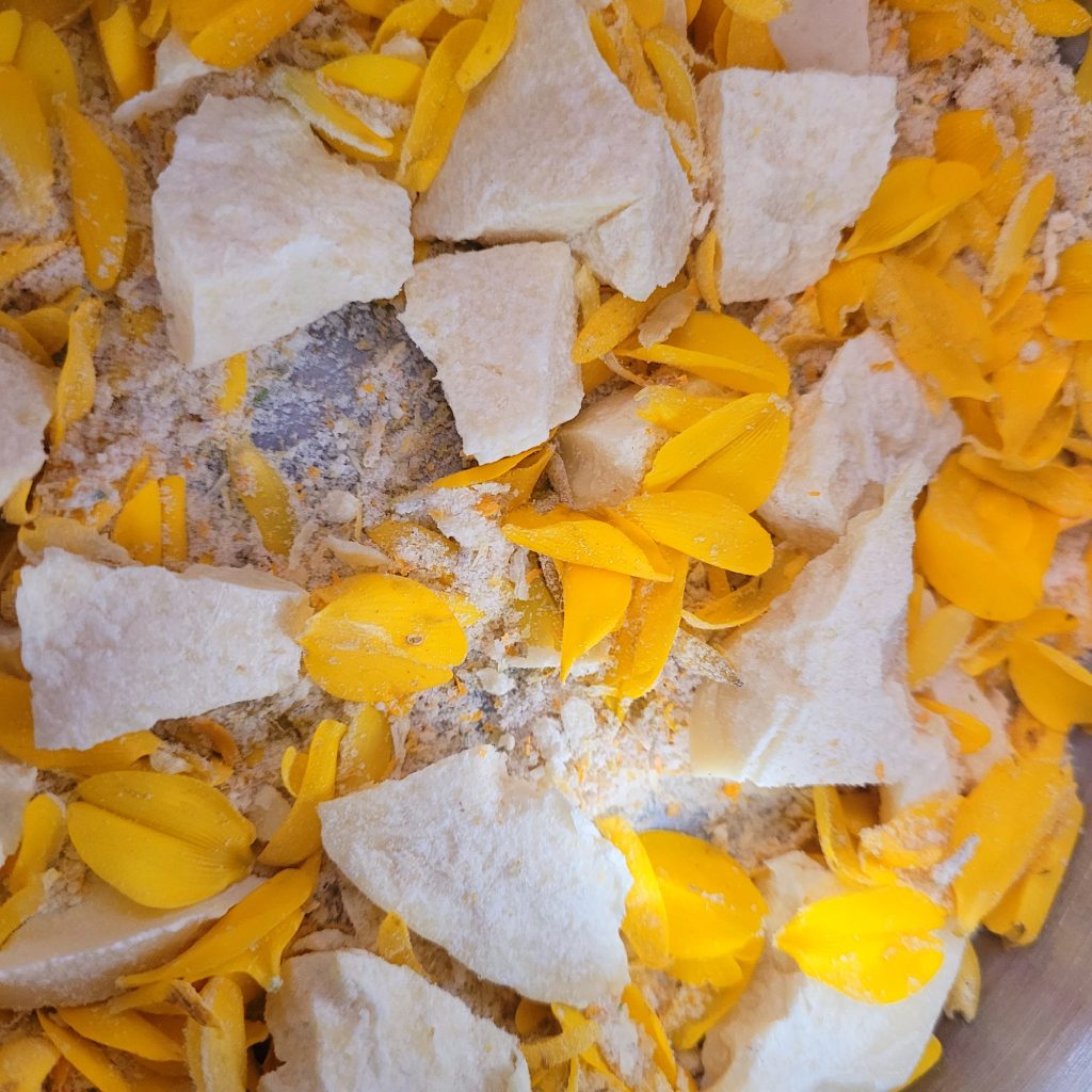 Coco butter and gorse petals before melting and infusing together