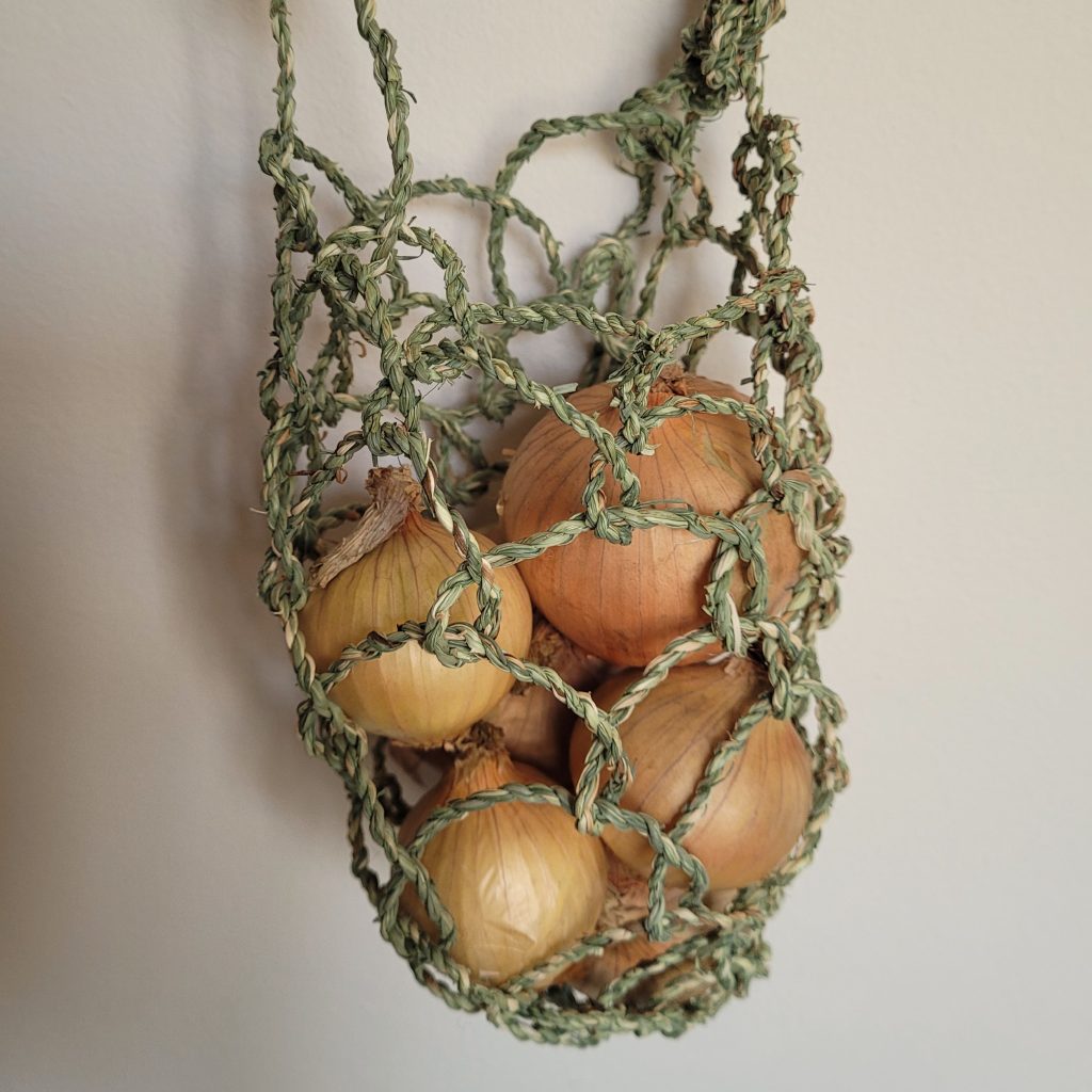 Looped bag made of invasive grass in Cornwall