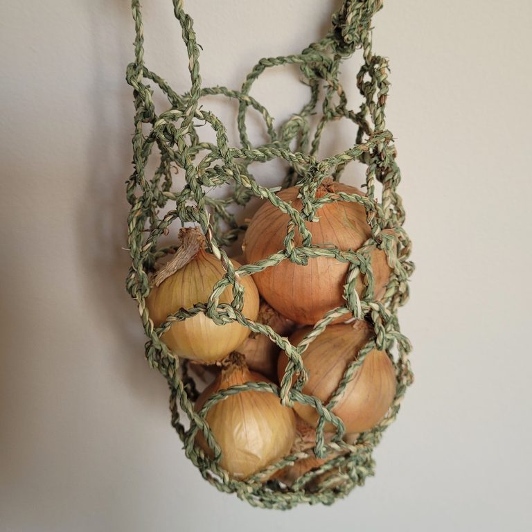 Looped bag made of invasive grass in Cornwall