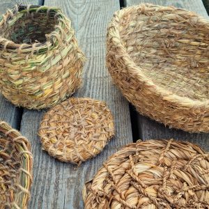 Selection of handmade bowls and mats made from UK plants