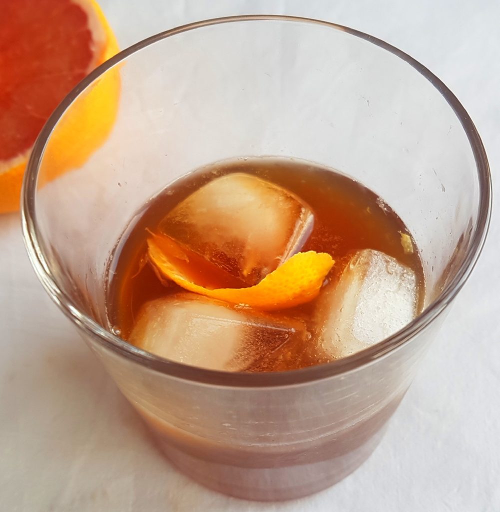 Dandelion coffee cocktail with ice and grapefruit photographed from above