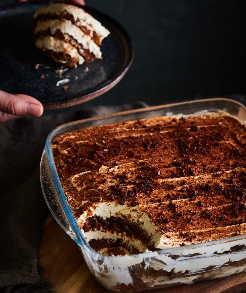 A slice taken out of a freshly assembled wild version of tiramisu