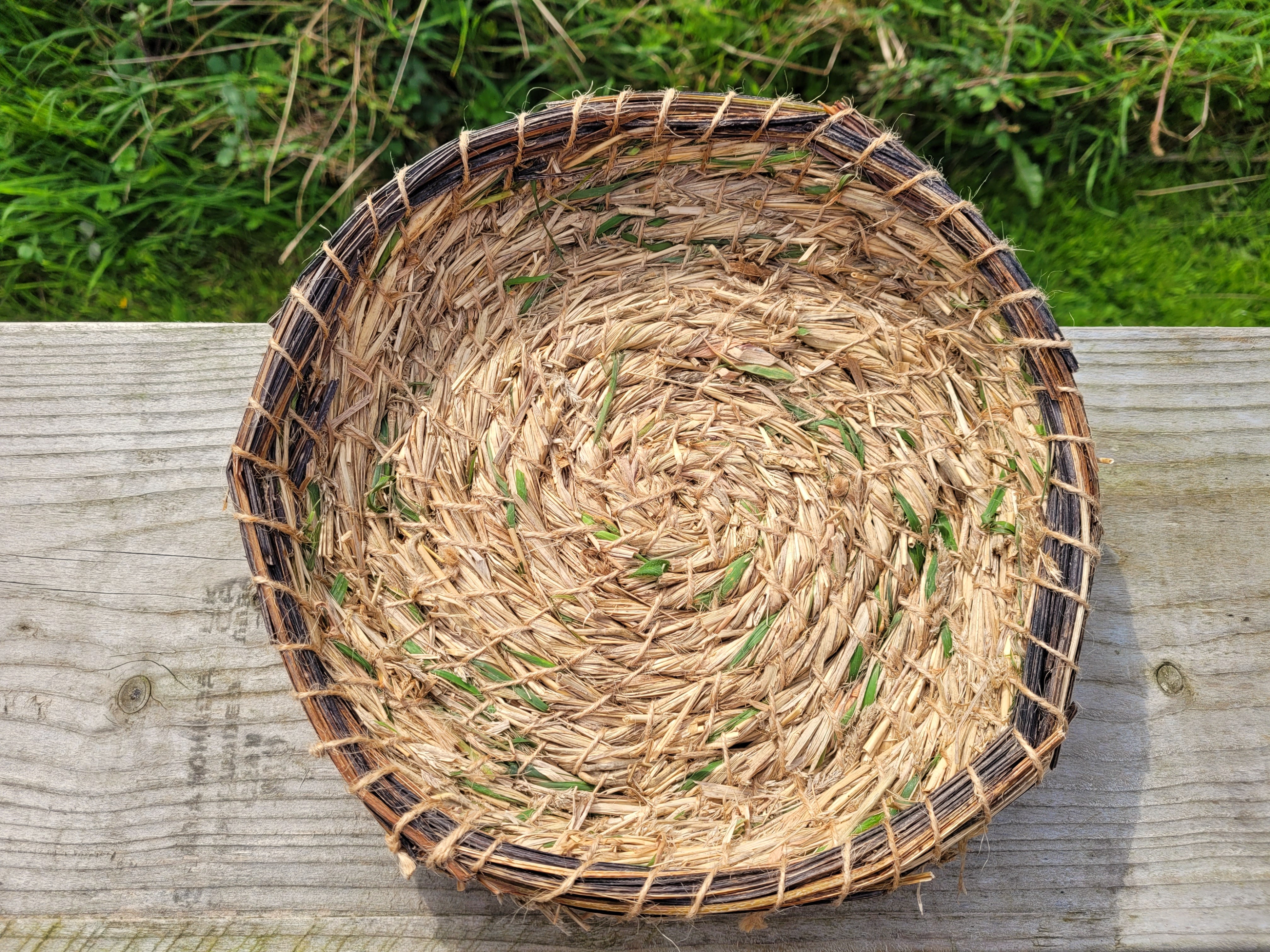 Aerial view of beautiful coiled bowl made from plants