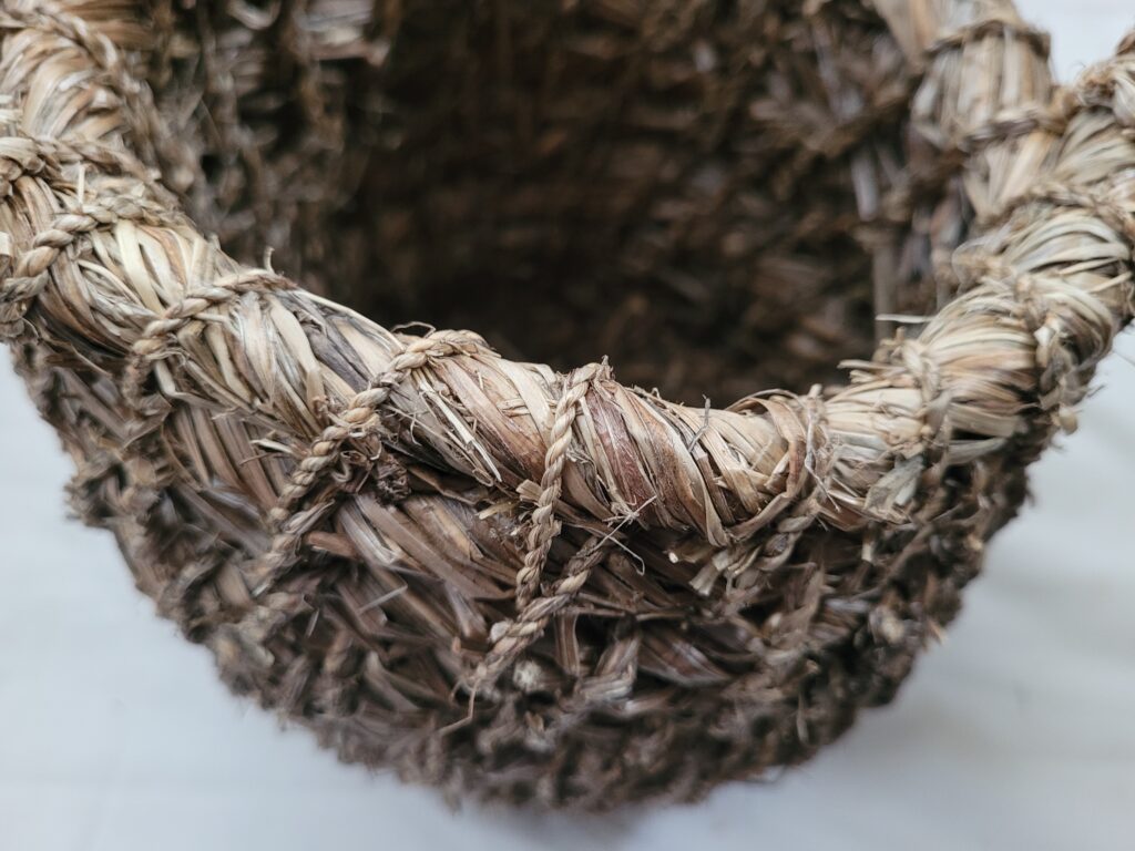 Detail of artisan, handmade pot made from 100% goosegrass
