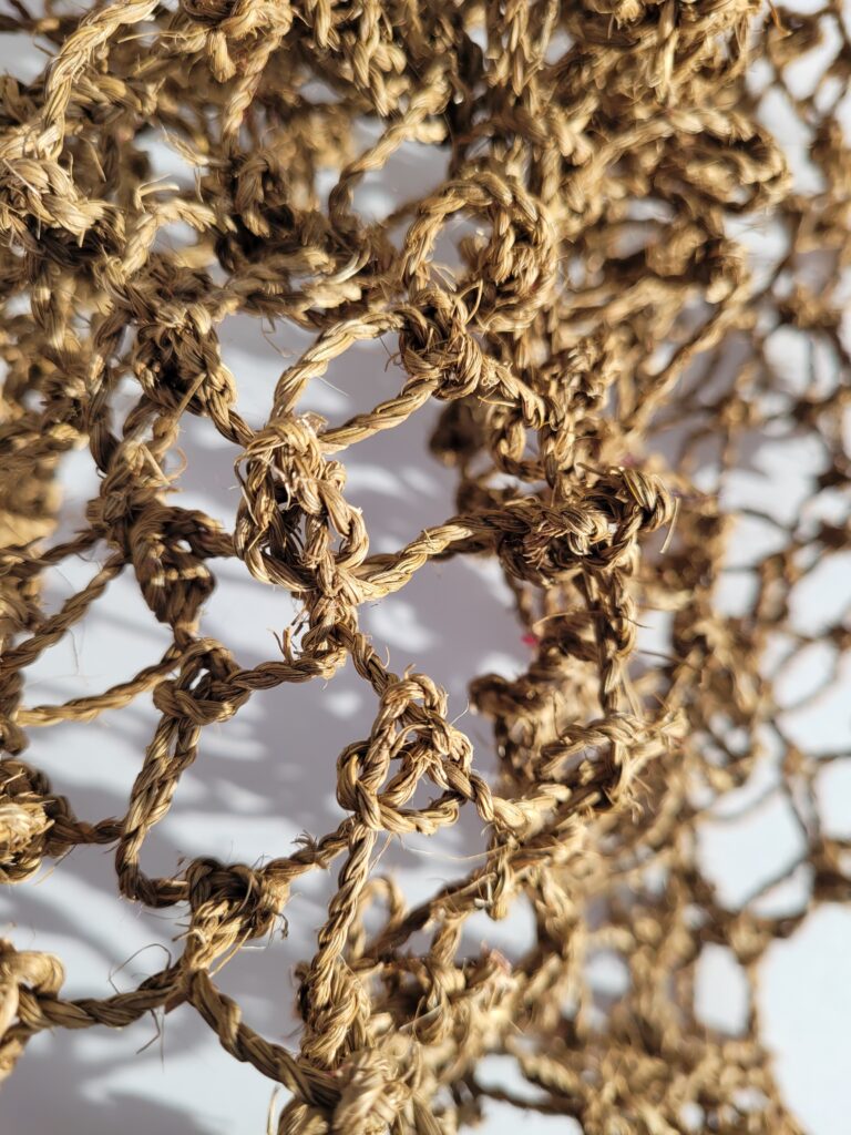 Details of a fishing net made from Cordyline plant fibres