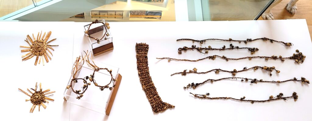 Various artisan creations made from 100% dandelions laid across a white background